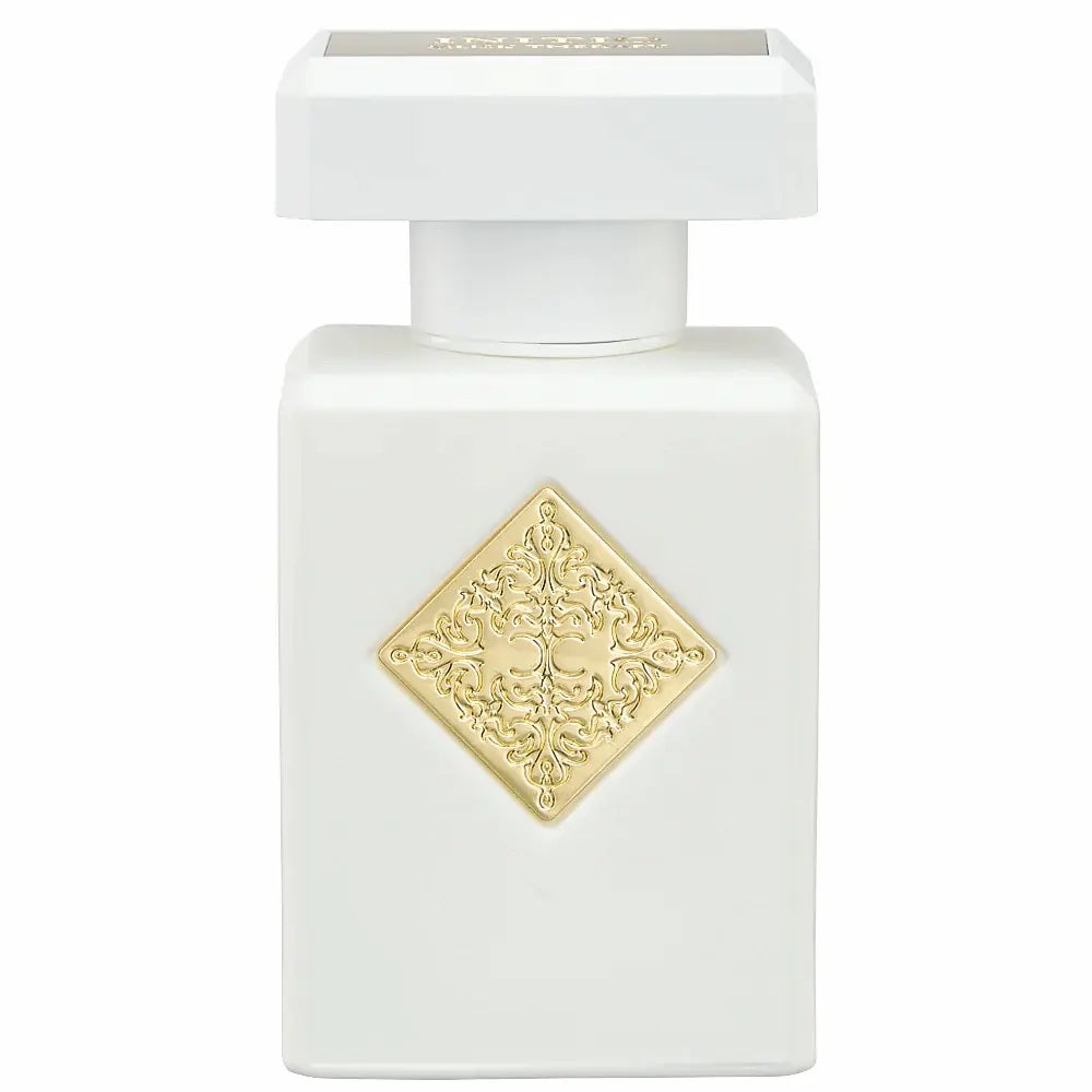 white initio musk therapy bottle with gold accents on a white background 