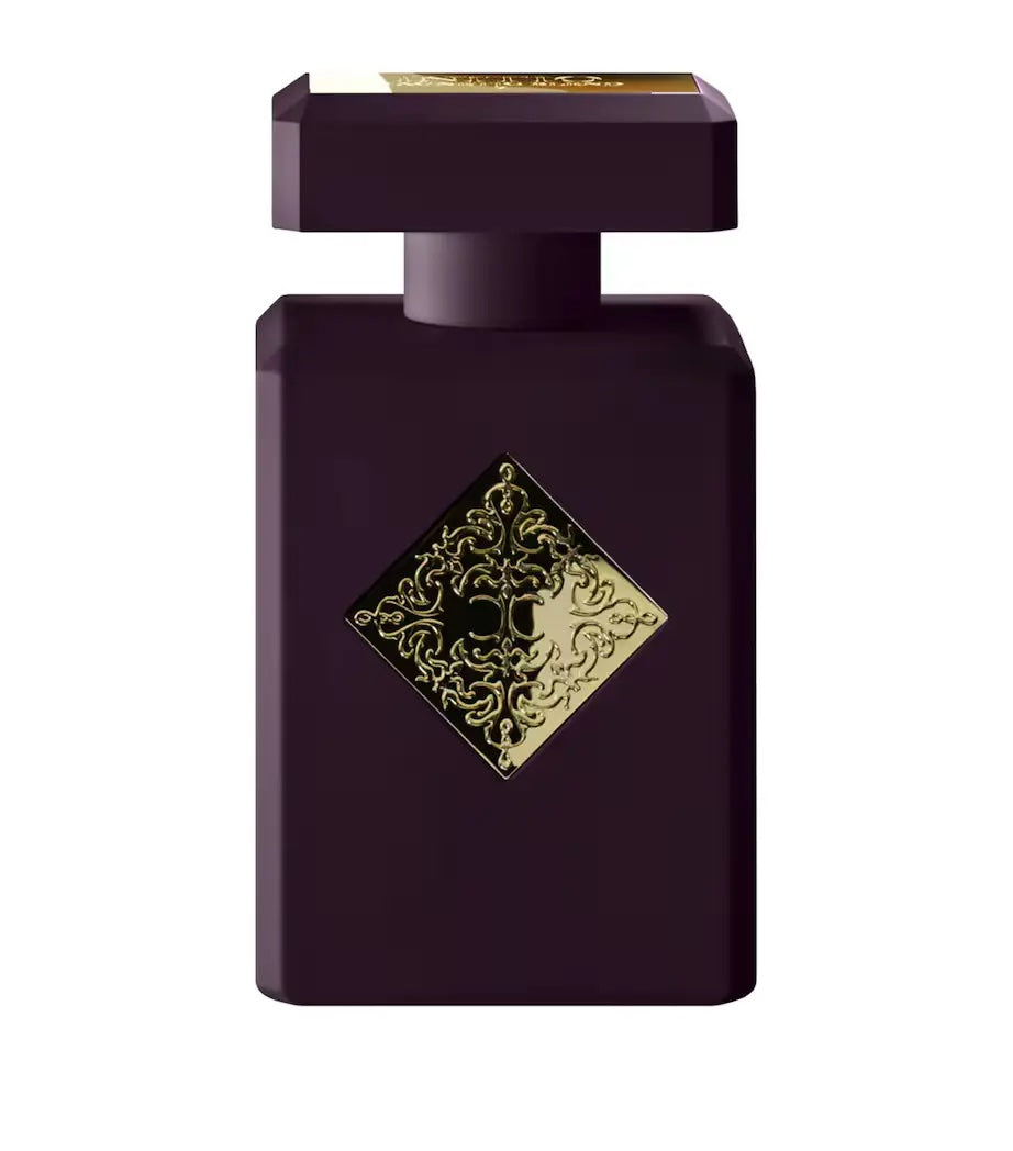 dark purple initio cant get enough perfume bottle with a gold label on a  white background