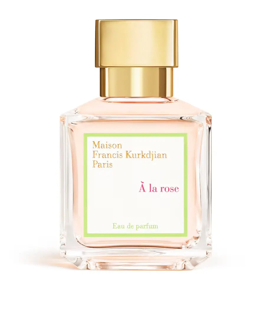 pink maison francis kurkdjian a la rose bottle with a gold cap on a white background