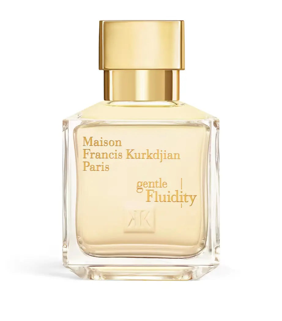 maison francis kurkdjian gentle fluidity gold glass bottle with a gold cap on a white background