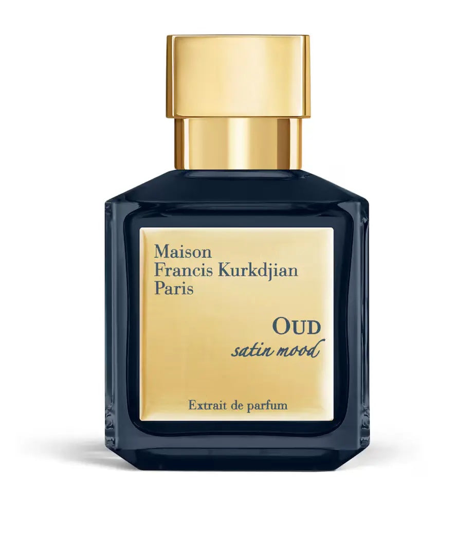 navy blue maison francis kurkdjian bottle with a gold cap and gold label on a white background
