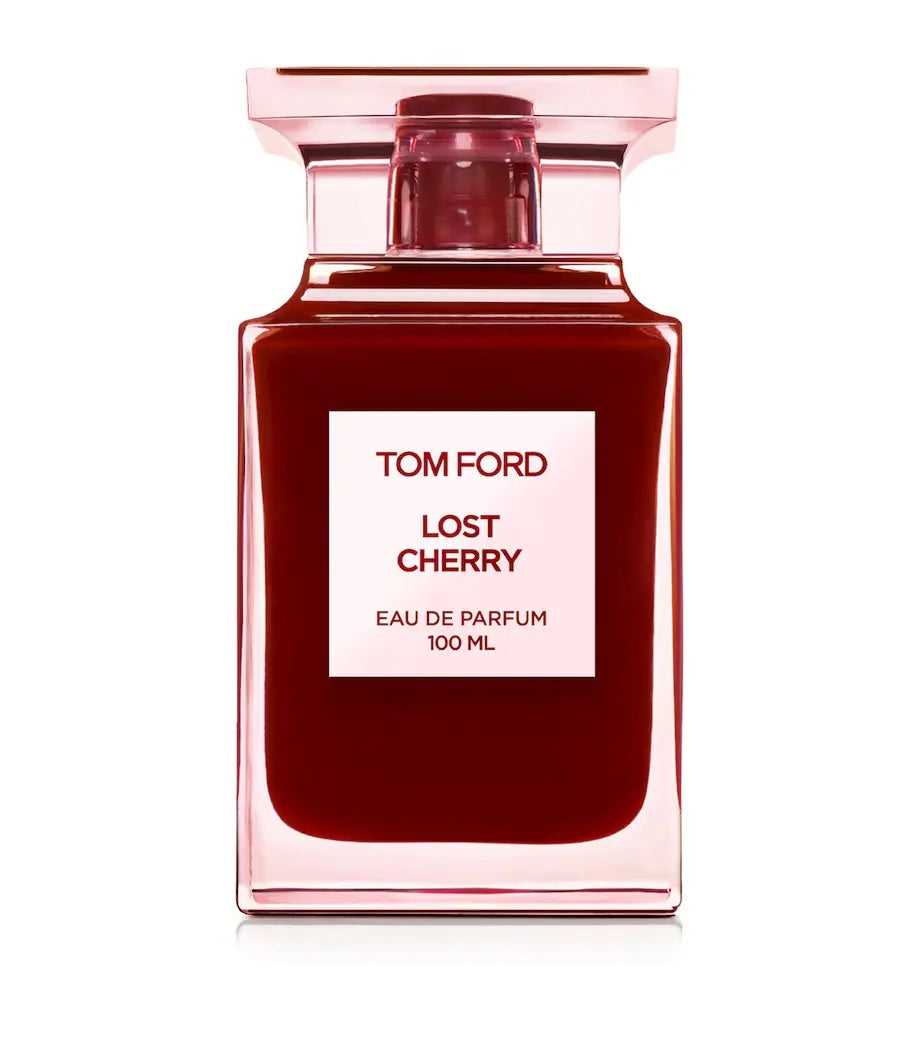 tom ford perfume bottle in red with a white label on a white background